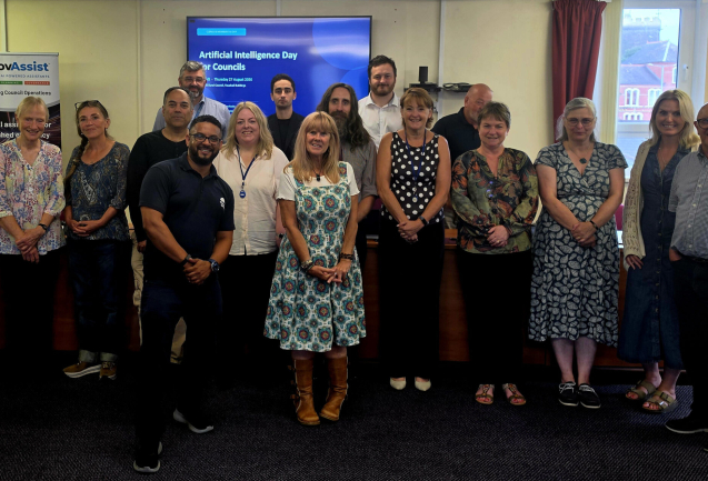 Group of attendees at the Llanelli Rural Council AI Day, standing together for a group photo in a meeting room.