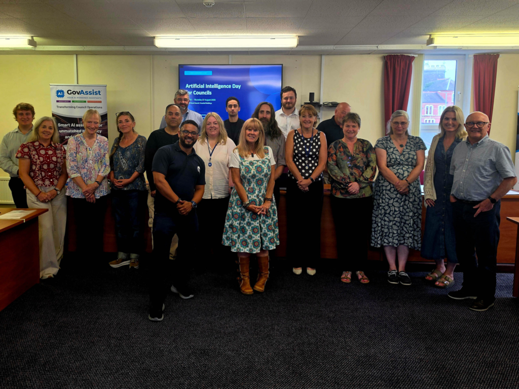 Group of attendees at the Llanelli Rural Council AI Day, standing together for a group photo in a meeting room.